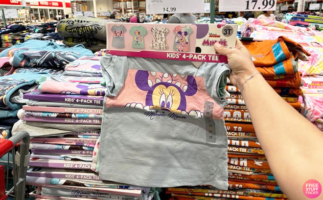 A Person Holding a Pack of Four Disney Minnie Mouse Kids Character Tees