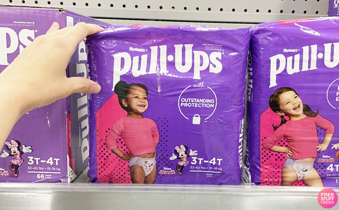 A Person Holding a Pack ok Huggies Pull Ups Girls Potty Training Pants
