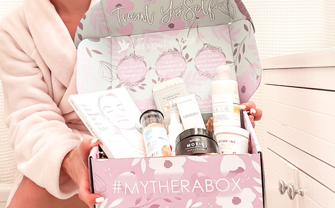 A Person Holding a TheraBox Self Care Subscription Box
