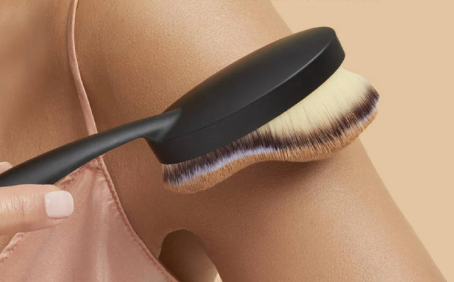 A Person Holding an IT Cosmetics Heavenly Luxe Body Foundation Brush 28