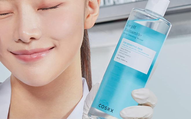 A Person Holding the COSRX Low pH Niacinamide Micellar Cleansing Water A Person Holding the COSRX Low pH Niacinamide Micellar Cleansing Water