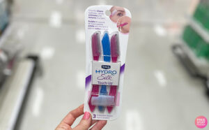 A Person Holding the Schick Hydro Silk Touch Up Dermaplaning Tool with Precision Cover 3 Count at a Store