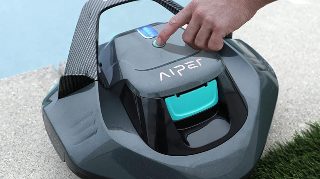 A Person Pushing the Power Button of Aiper Seagull SE Cordless Robotic Pool Cleaner