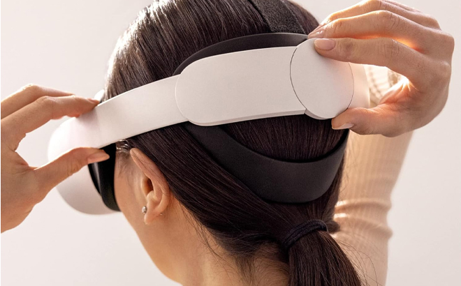 A Person Putting the Meta Quest 2 Virtual Reality Headset