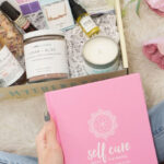 A Person Unboxing a TheraBox Self Care Subscription Box