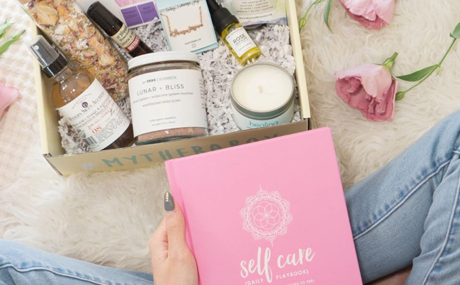 A Person Unboxing a TheraBox Self Care Subscription Box