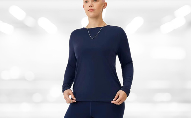 A Person Wearing Allbirds Womens Long Sleeve Shirt in Blue