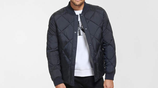A Person Wearing Calvin Klein Reversible Quilted Jacket
