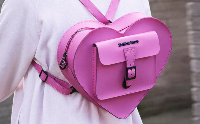 A Person Wearing Dr Martens Leather Heart Shaped Backpack