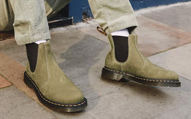 A Person Wearing Dr Martens Tumbled Nubuck Leather Chelsea Boots