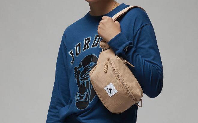 A Person Wearing Jordan Flight Crossbody Bag A Person Wearing Jordan Flight Crossbody Bag