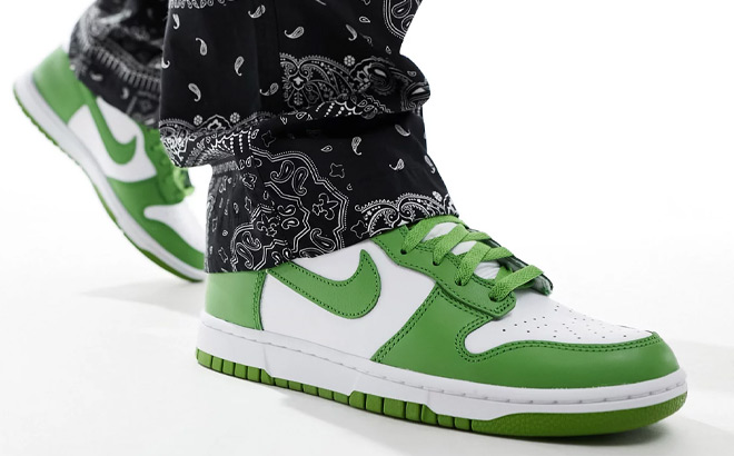 A Person Wearing Nike Dunk Hi Retro Shoes in White and Green Color