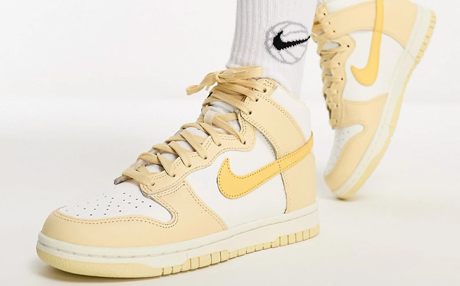 A Person Wearing Nike Dunk High Womens Shoes