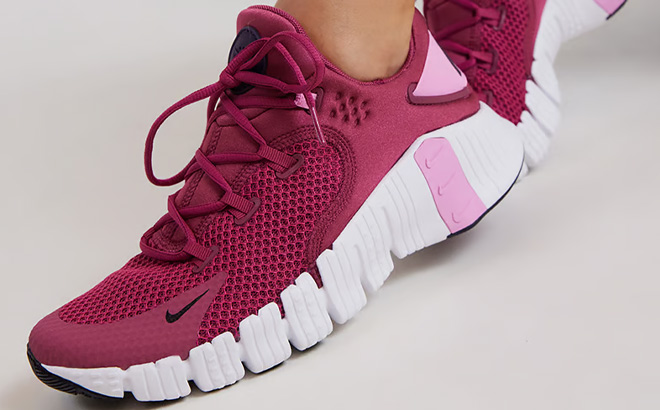 A Person Wearing Nike Free Metcon 4 Womens Workout Shoes