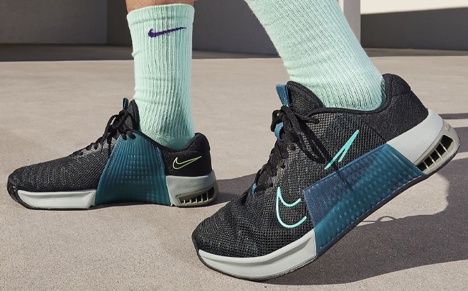 A Person Wearing Nike Metcon 9 Mens Workout Shoes A Person Wearing Nike Metcon 9 Mens Workout Shoes