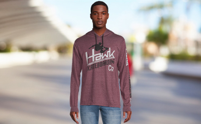 A Person Wearing Tony Hawk Mens Skate Co Graphic Hoodie in Maroon Color