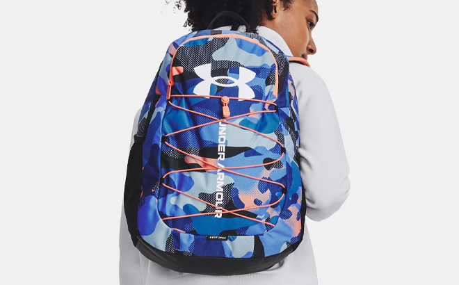 A Person Wearing Under Armour Hustle Sport Backpack