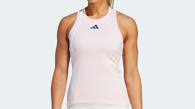 A Person Wearing Womens Clubhouse Premium Classic Tennis Tank Top in Clear Pink and White colors