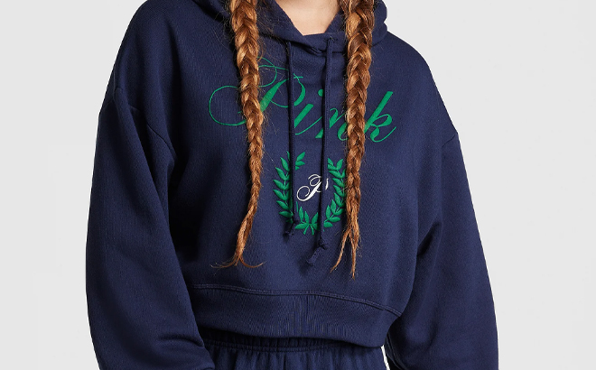 A Person Wearing the Victorias Secret PINK Everyday Fleece Cropped Hoodie in Navy