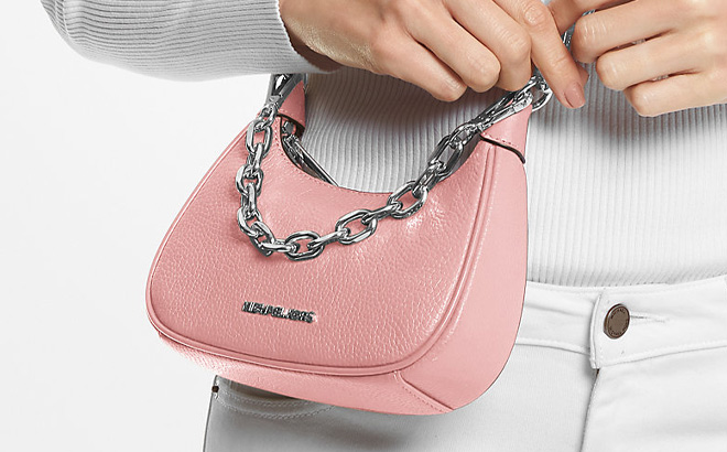 A Person is Holding Michael Kors Cora Extra Small Pebbled Leather Shoulder Bag