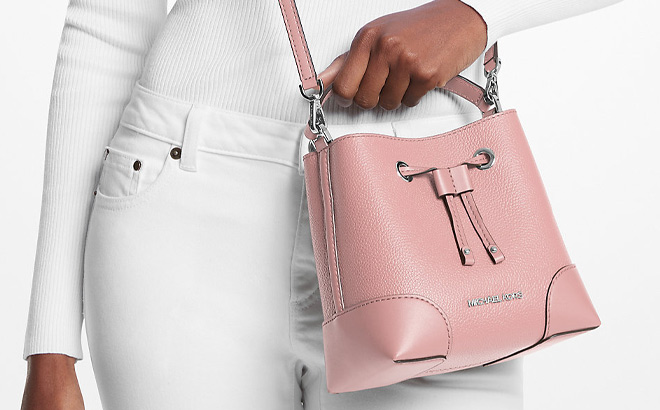 A Person is Holding Michael Kors Mercer Small Pebbled Leather Bucket Bag