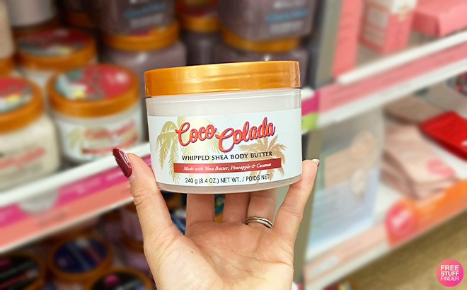 A Person is Holding Tree Hut Coco Colada Shea Body Butter