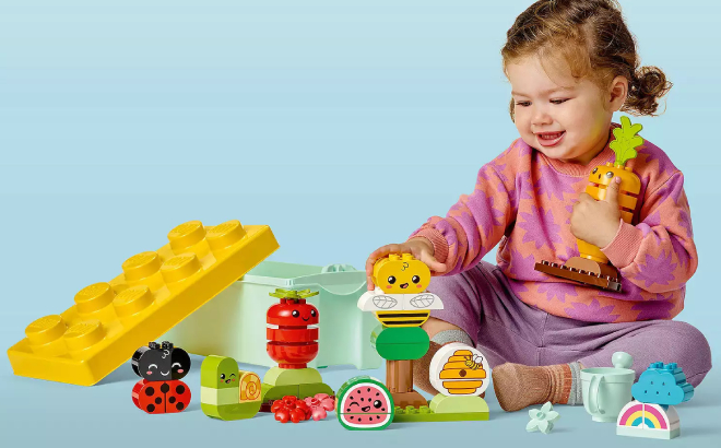 A Toddler Playing with LEGO DUPLO My First Organic Garden Brick Box Set
