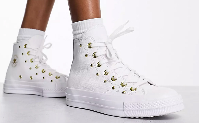 A Woman Wearing Converse Chuck 70 Hi Star Studded Sneakers