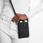 A Woman Wearing Michael Kors Saffiano Leather Smartphone Crossbody Bag