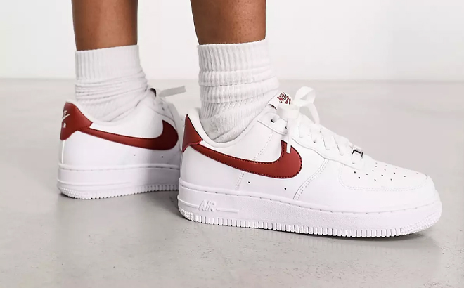 A Woman Wearing Nike Air Force 1 07 Shoes