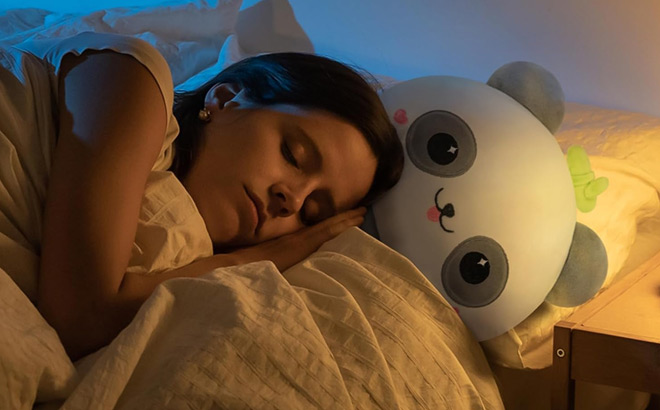 A person Sleeping beside a Mewaii 8 inch Mushroom Plush Panda Plush