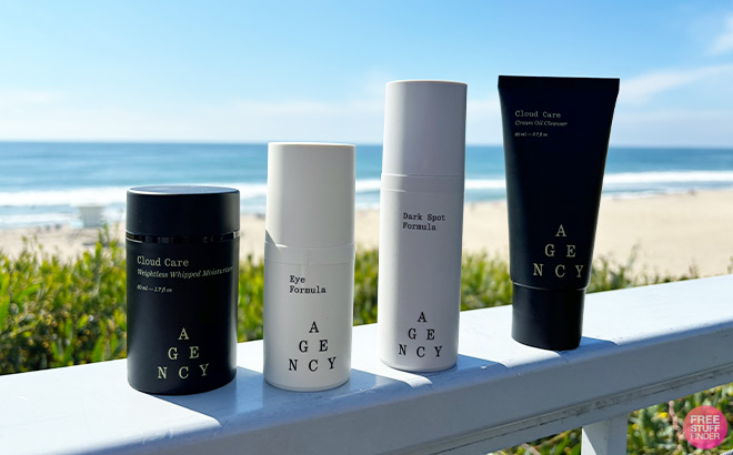 Agency 4 Piece Skincare Kit on a Wooden Fence on the Beach