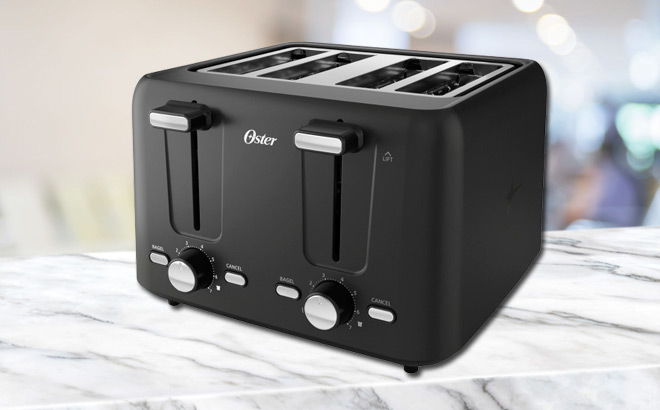 An Oster 4 Slice Toaster on a Marble Kitchen Counter