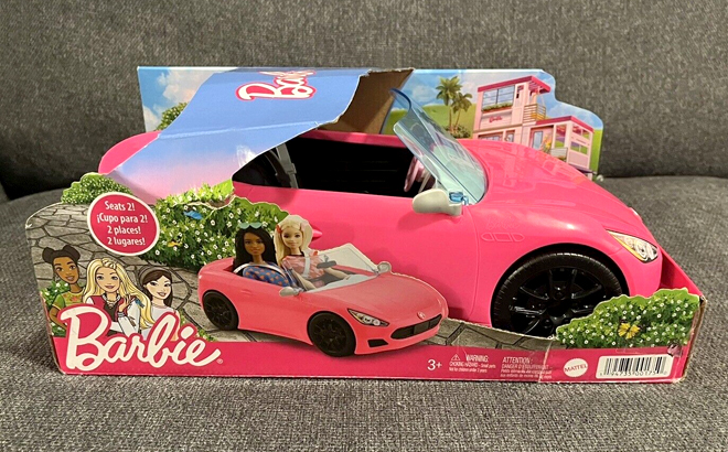 Barbie 2 Seater Convertible Car Toy on a Couch