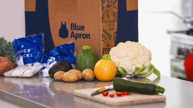 Blue Apron Box on a Counter Top with Fresh Food 