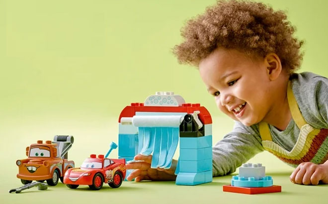 Boy Playing With LEGO Creator Toy