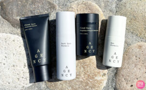 Four Agency Skincare Products on Concrete