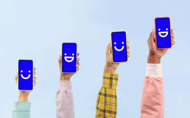 Four People Holding Phones with Visible on the Backgrounds