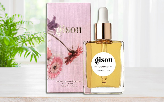 Gisou Honey Infused Hair Oil with a Box on the Counter