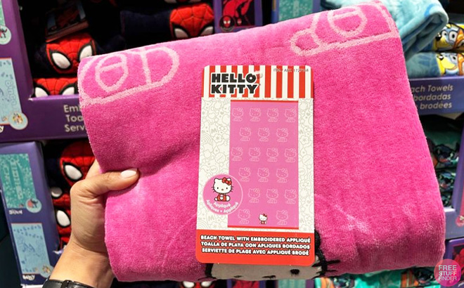 Hand Holding Hello Kitty Beach Towel at Costco