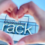 Hands Forming a Heart Shape in Front of Nordstrom Rack