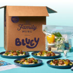 Home Chef Bluey Box next to Food on a Tabletop