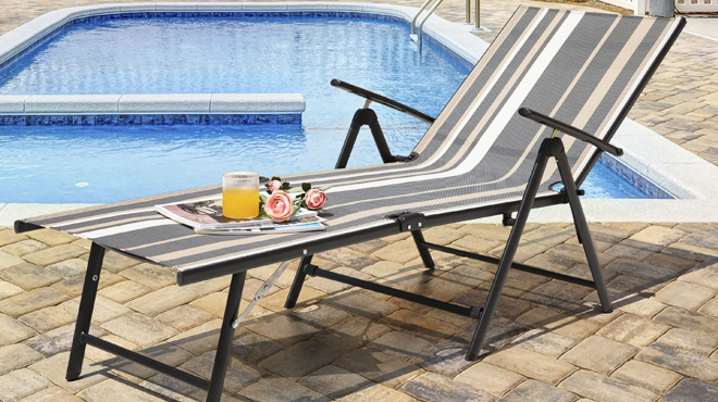Iron Frame Chaise Lounge Chair Beside a Swimming Pool