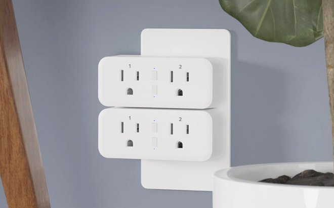 KMC Smart Plug Duo Plugged in a Wall Outlet
