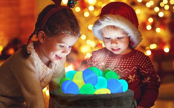 Little Kids Looks Amazed with a Basket of Glow in the Dark Easter Eggs