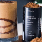 MUDWTR Mushroom Based Coffee Alternative in a Tin Next to a Drink