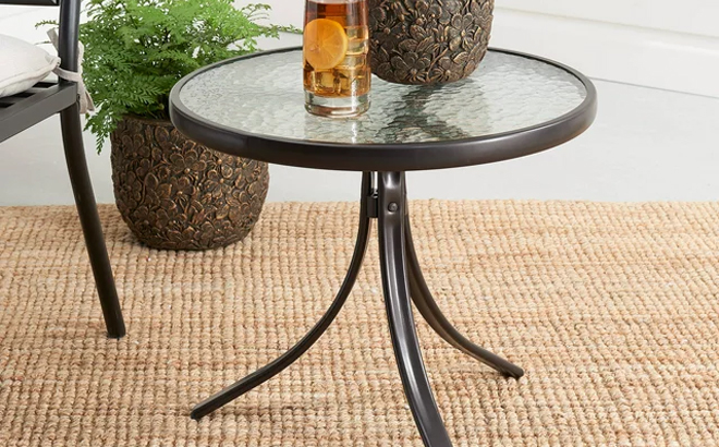 Mainstays Round Glass Side Table on a Patio