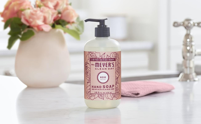 Mrs Meyers Clean Day Liquid Hand Soap in the Scent Rose on a Table Mrs Meyers Clean Day Liquid Hand Soap in the Scent Rose on a Table