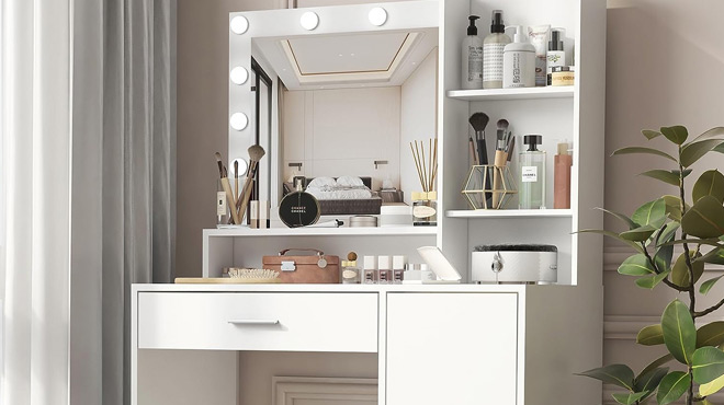 Palimder Vanity Desk with Mirror and Light Filled with Makeup and Makeup Accessories