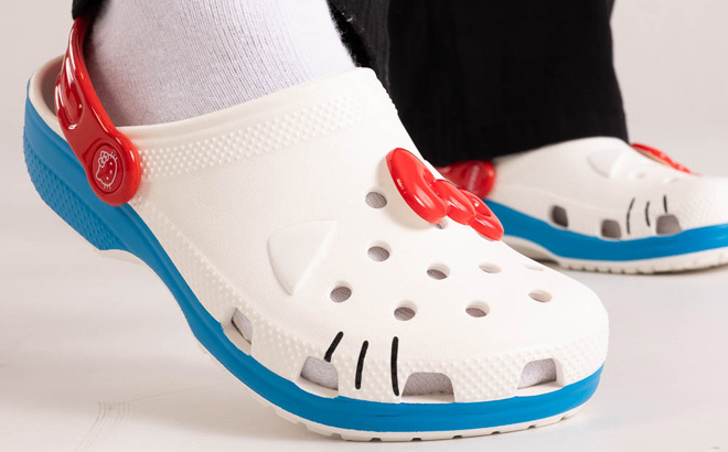 Person Wearing Hello Kitty Clogs